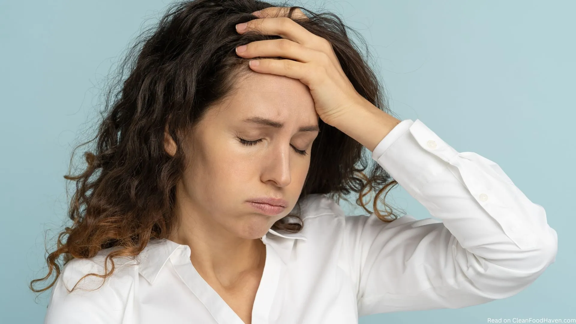 Woman holding her head in pain or to express feeling stressed out and frustrated