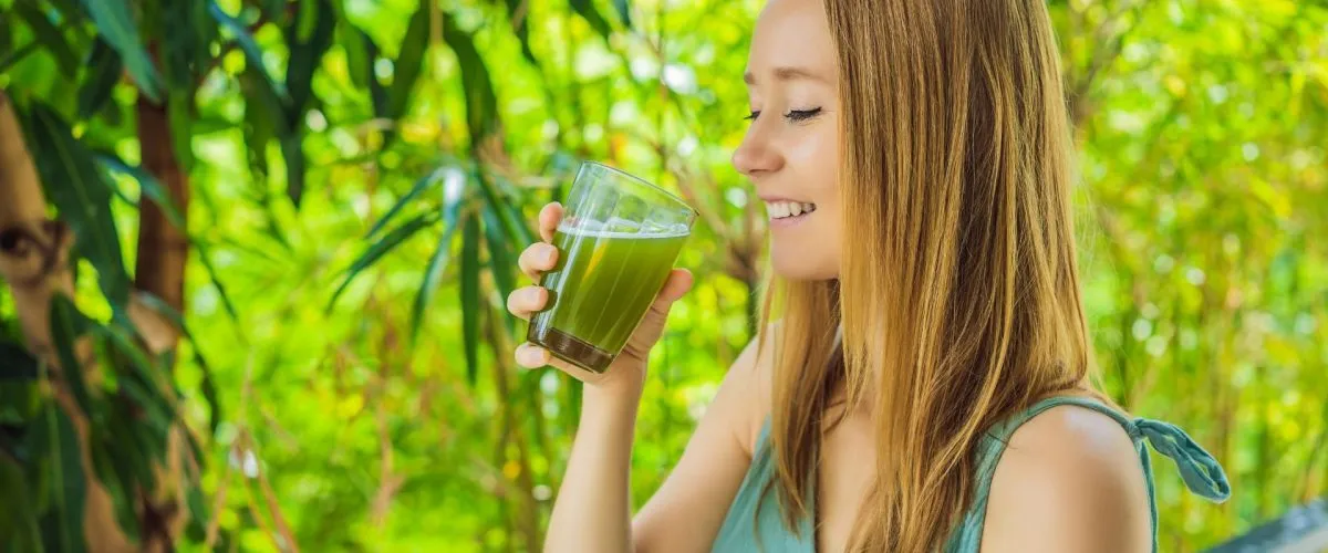 woman enjoying celery juice, your guide to successful celery juicing